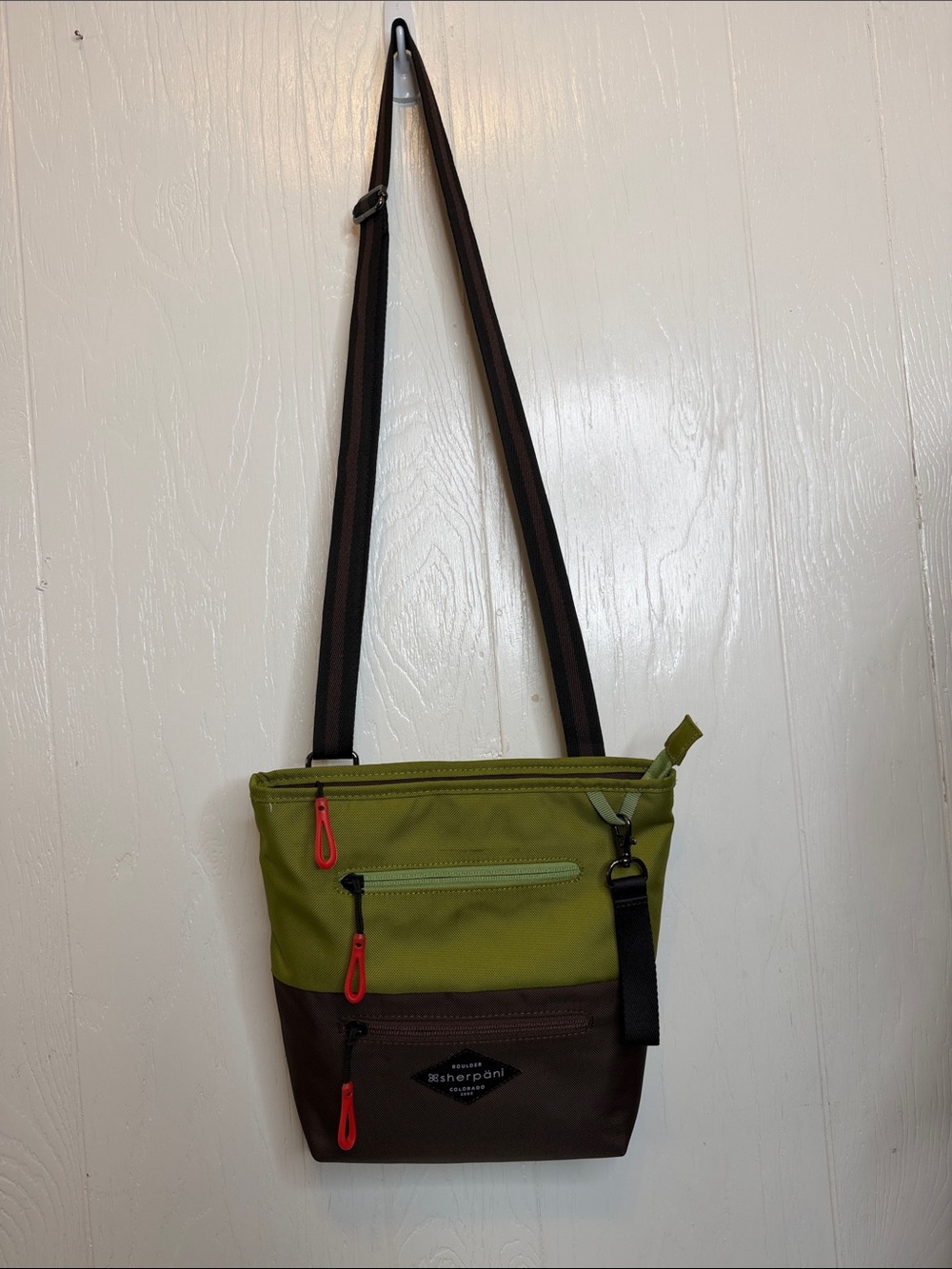 Sherpani Sadie Olive and Brown Crossbody Bag with Orange Accents